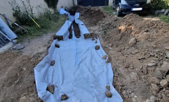 Mise en place d'un drain pour eau pluviale à Sotta